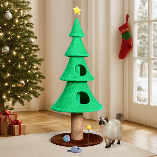 Christmas tree cat tower with 2 condos and a cat beside it
